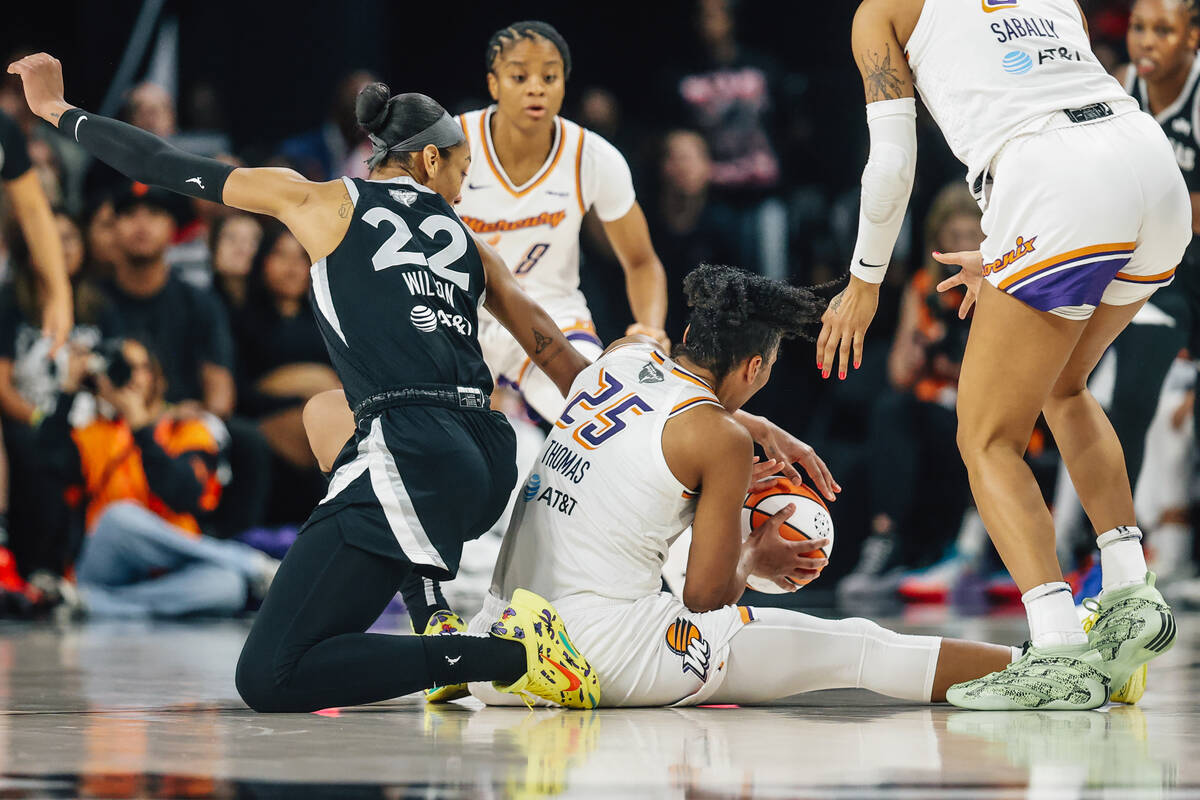 Phoenix Mercury forward Alyssa Thomas (25) tries tk keep the ball from Aces center A'ja Wi ...