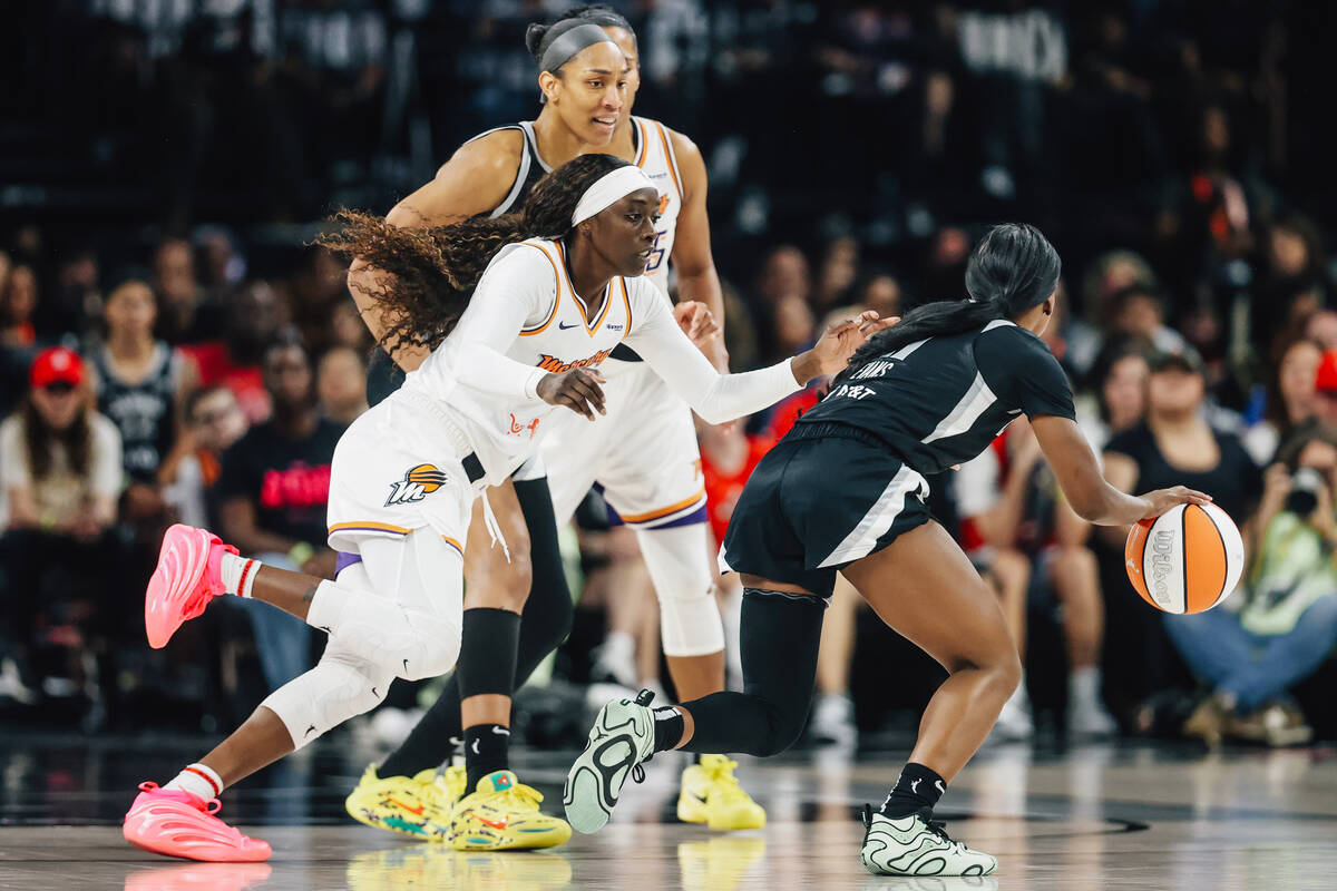 Phoenix Mercury guard Kahleah Copper (2) defends as Aces guard Dana Evans (11) dribbles the bal ...