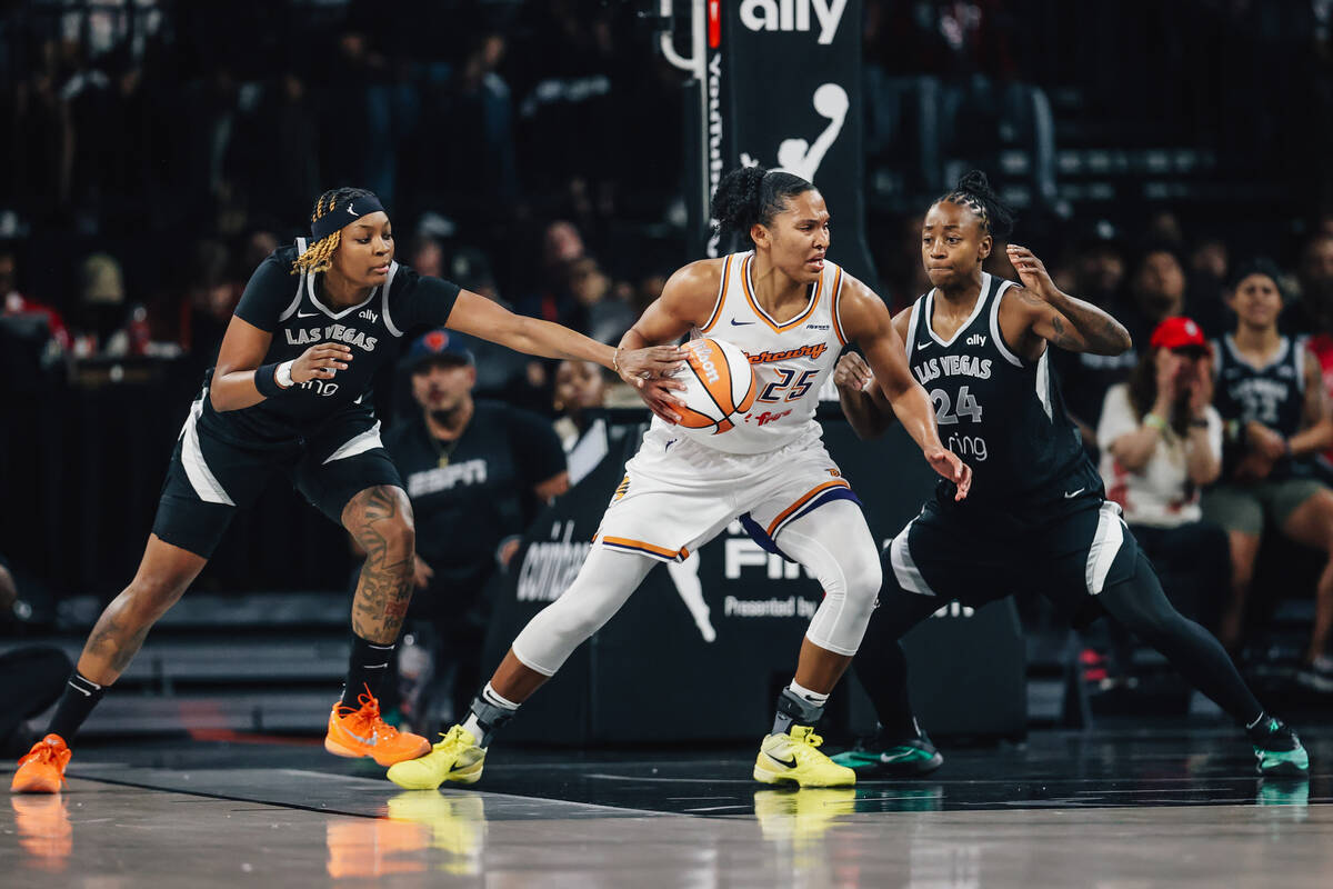 Aces forward NaLyssa Smith (3) and Aces center A'ja Wilson (22) play defense as Phoenix Me ...