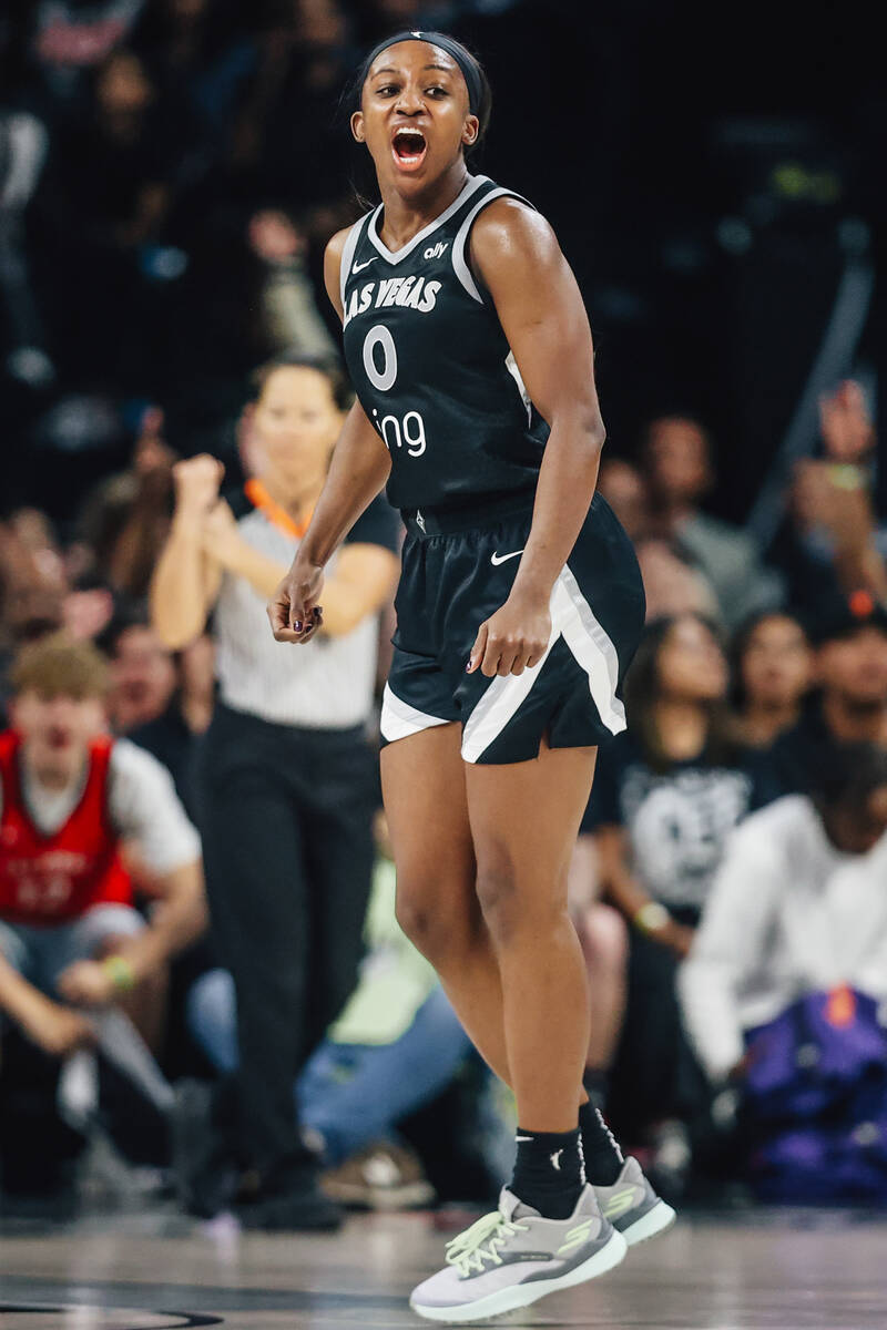 Aces guard Jackie Young (0) celebrates during game two of of a WNBA finals game between the Ace ...