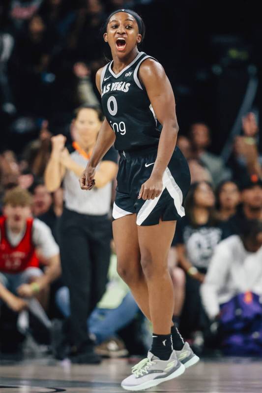 Aces guard Jackie Young (0) celebrates during game two of of a WNBA finals game between the Ace ...