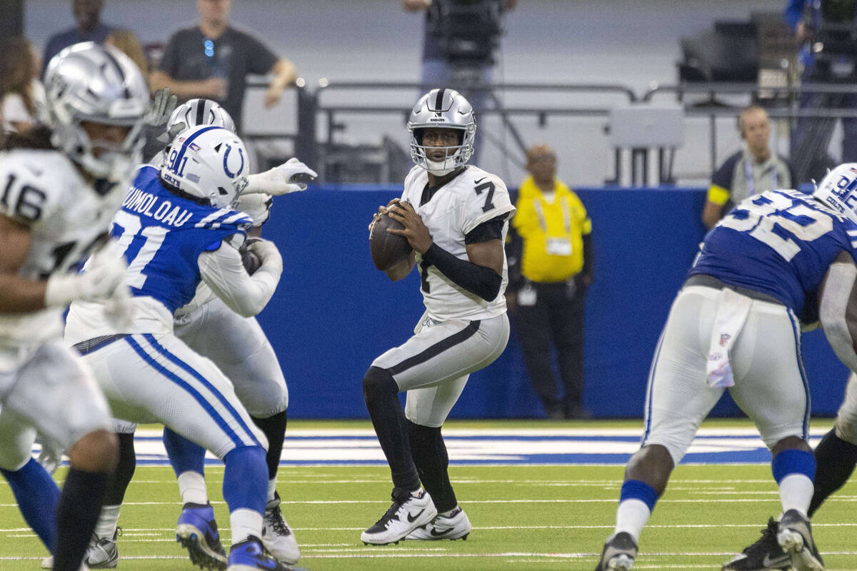 Raiders quarterback Geno Smith (7) prepares to throw against the Indianapolis Colts during the ...