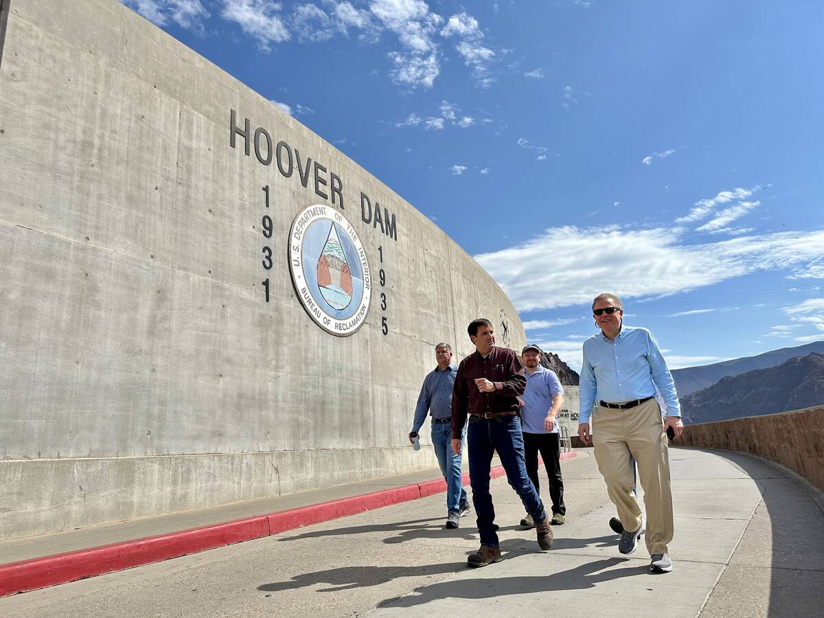 Scott Cameron, right, takes a tour of Hoover Dam in July. (Bureau of Reclamation)