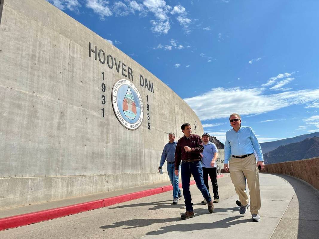 Scott Cameron, right, takes a tour of Hoover Dam in July. (Bureau of Reclamation)