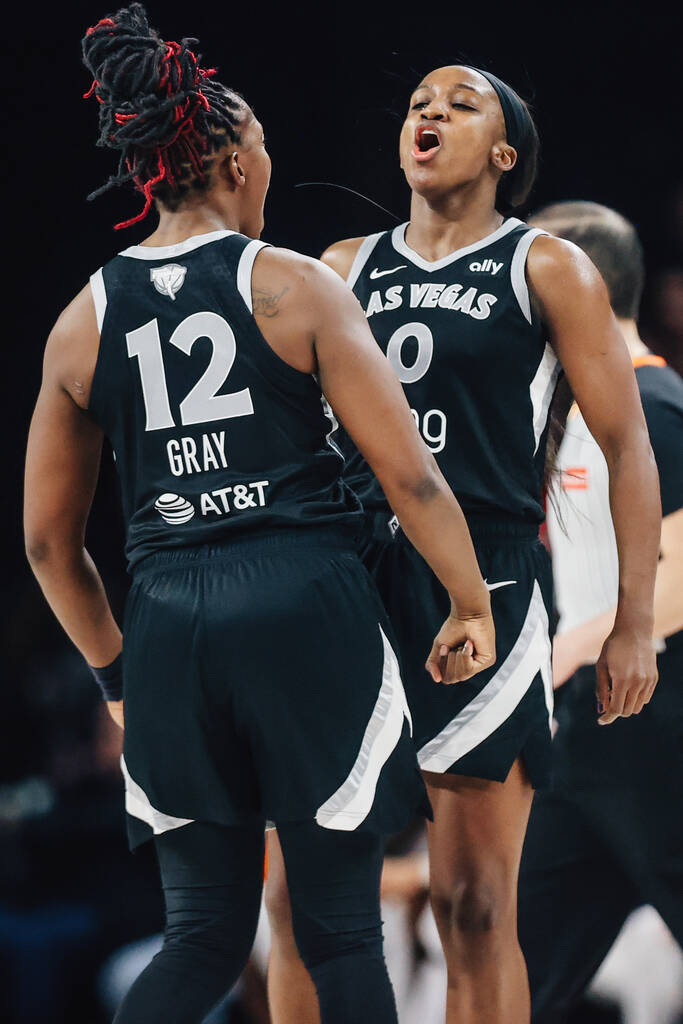 Aces guard Jackie Young (0) and Aces guard Chelsea Gray (12) celebrate during game two of of a ...