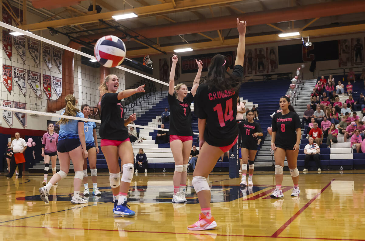 Coronado players celebrate as they defeat Foothill in a volleyball game at Coronado High School ...