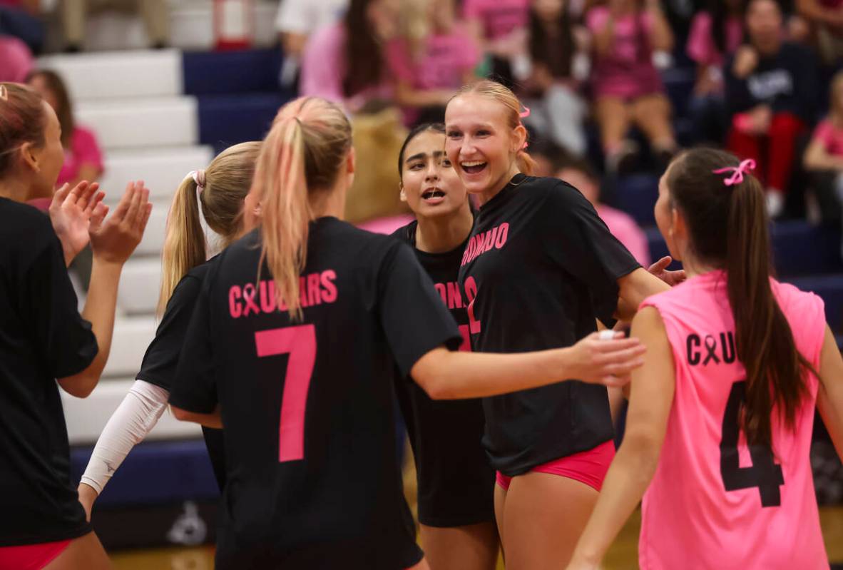 Coronado's outside hitter Julie Beckham (2) celebrates a play with teammates during a voll ...