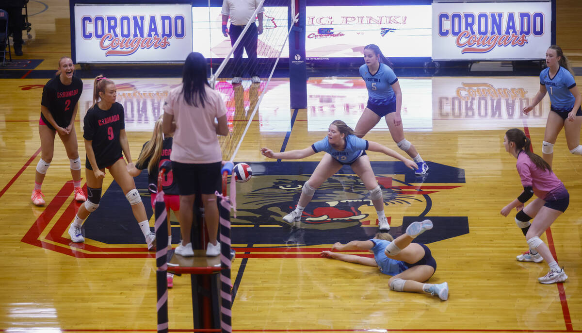 Foothill players try to save the ball during a volleyball game at Coronado High School on Monda ...