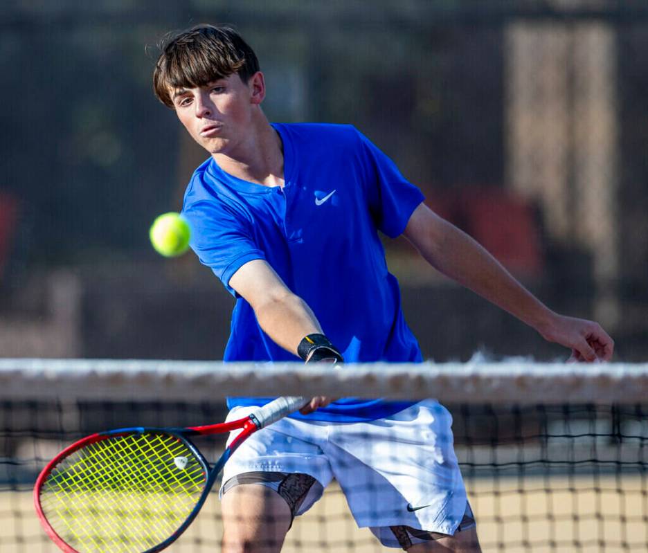 Bishop Gorman's Lucas Rago returns a ball against Faith Lutheran during their singles NIAA ...