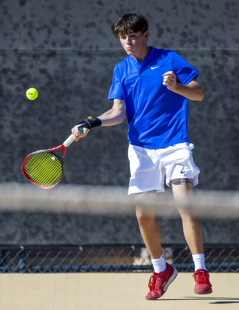 Bishop Gorman's Lucas Rago returns a ball against Faith Lutheran during their singles NIAA ...