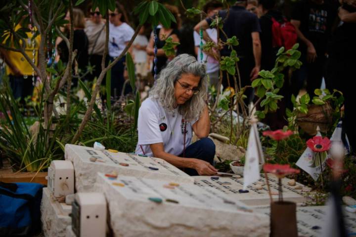 People attend a memorial service marking two years since the Oct. 7, 2023, Hamas cross-border a ...
