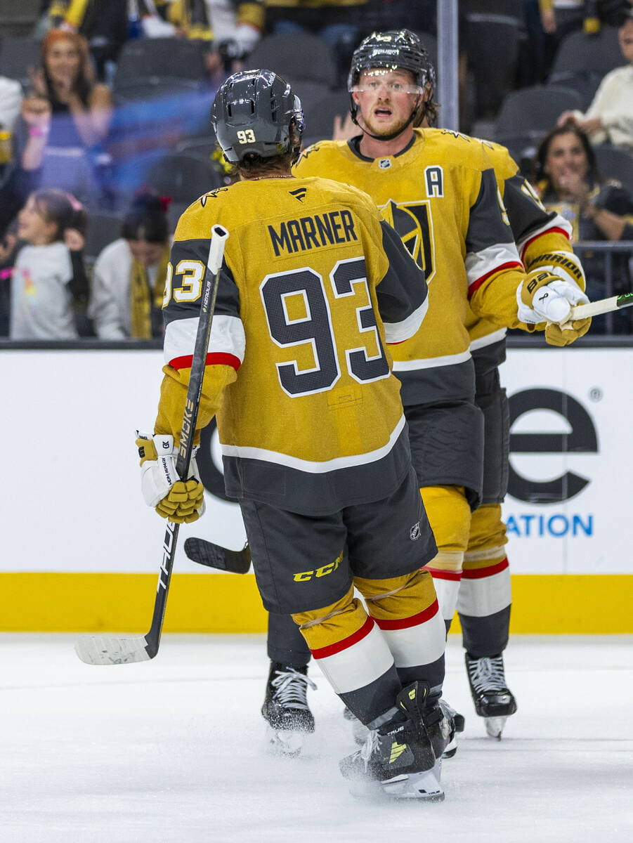 Golden Knights center Jack Eichel (9) is congratulated on his second goal by Golden Knights rig ...