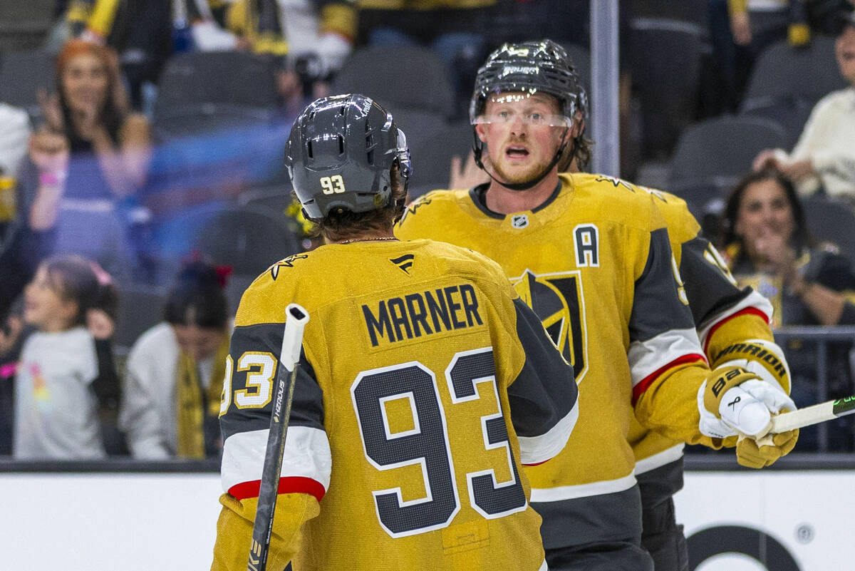 Golden Knights center Jack Eichel (9) is congratulated on his second goal by Golden Knights rig ...