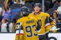 Golden Knights center Jack Eichel (9) is congratulated on his second goal by Golden Knights rig ...