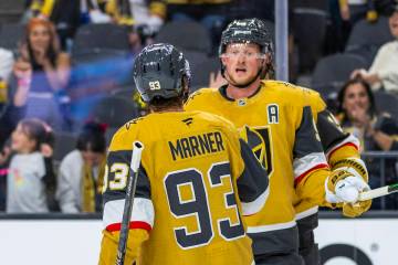 Golden Knights center Jack Eichel (9) is congratulated on his second goal by Golden Knights rig ...