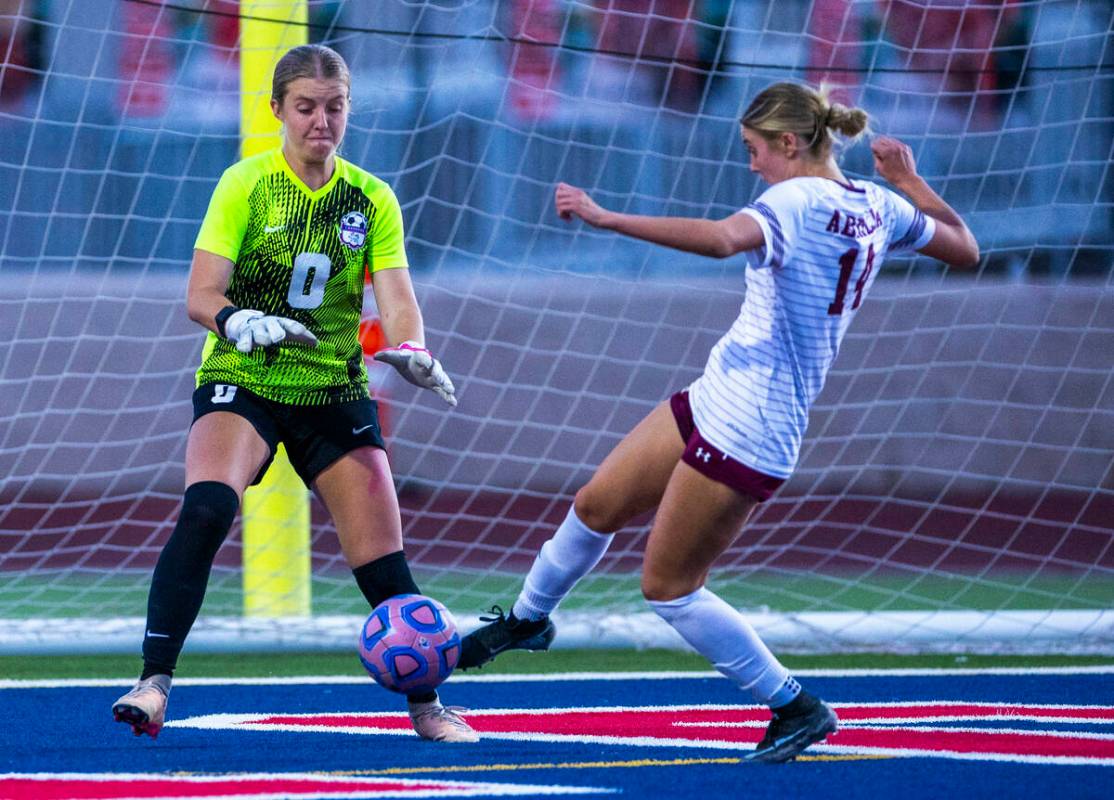 Coronado goalie Lilian Foss (0) takes on Faith Lutheran's Kloe Abdalla (14) as she attempt ...