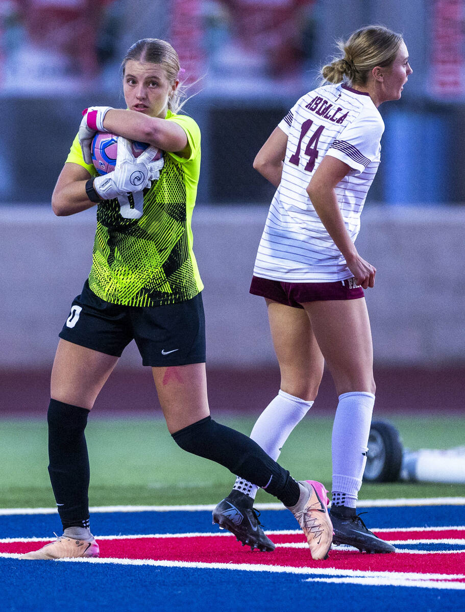 Coronado goalie Lilian Foss (0) secures a ball against Faith Lutheran's Kloe Abdalla (14) ...