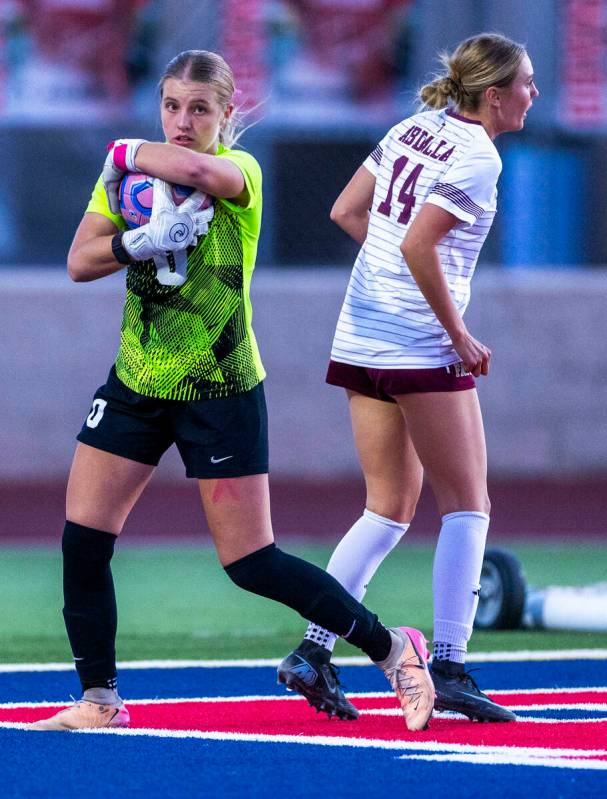 Coronado goalie Lilian Foss (0) secures a ball against Faith Lutheran's Kloe Abdalla (14) ...