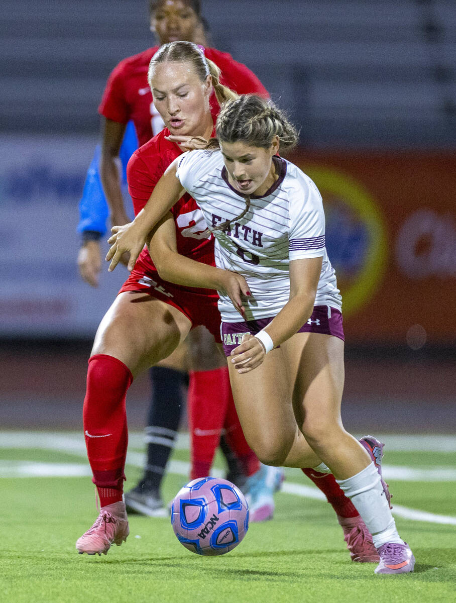 Coronado's Cate Gusick (20) battles for position as Faith Lutheran's Olivia Stark (8) ...