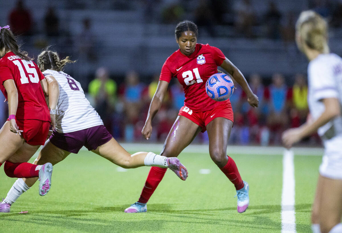Coronado's Jazmine McCallum (21)looks to send the ball ahead against Faith Lutheran during ...