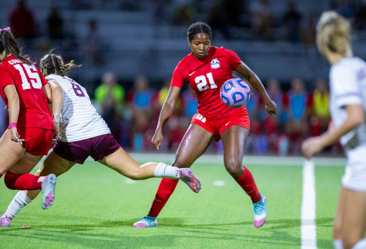 Coronado's Jazmine McCallum (21)looks to send the ball ahead against Faith Lutheran during ...