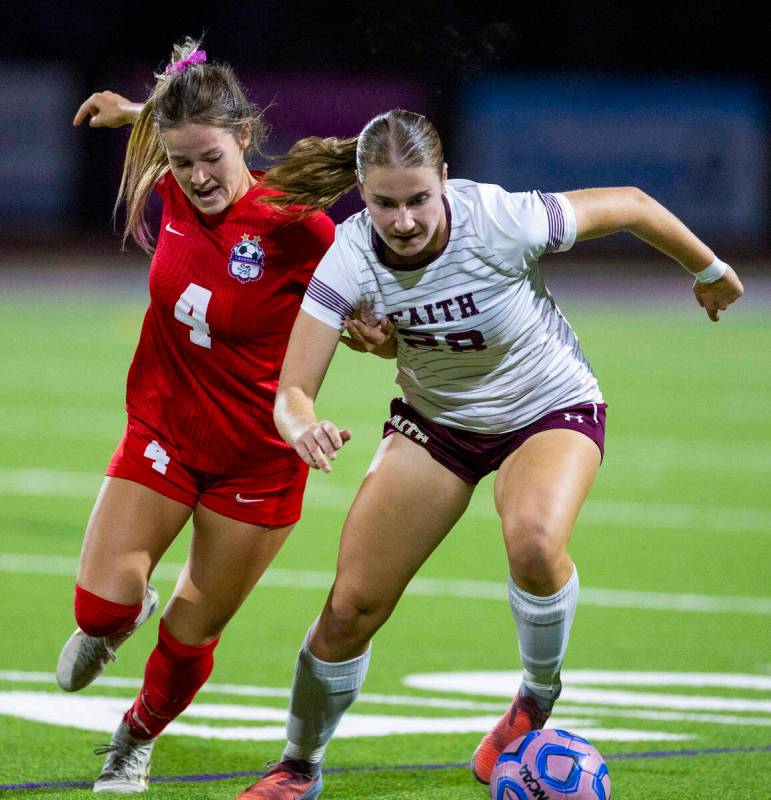 Coronado's Ella Schultz (4) battles for the ball with Faith Lutheran's Allie Rabe (28 ...