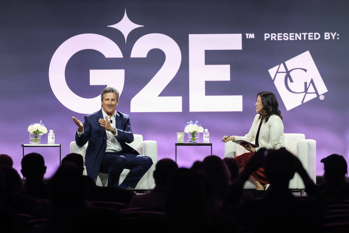 Bill Hornbuckle, left, CEO and President of MGM Resorts International, delivers the keynote spe ...