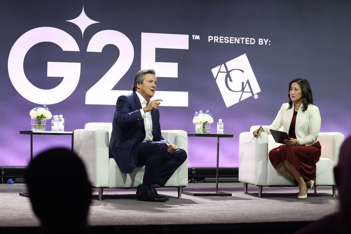 Bill Hornbuckle, left, CEO and President of MGM Resorts International, delivers the keynote spe ...
