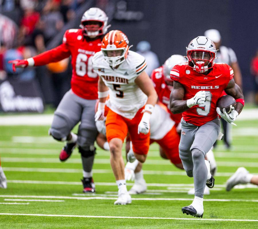UNLV running back Jai'Den Thomas (9) runs to the end zone as Idaho State Bengals safety Ja ...