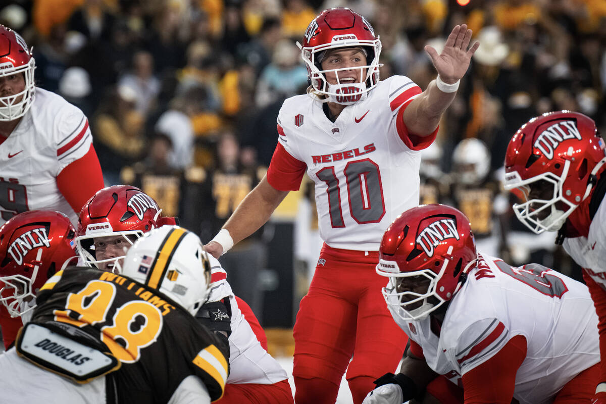 UNLV quarterback Anthony Colandrea calls and audible during their game against University of Wy ...
