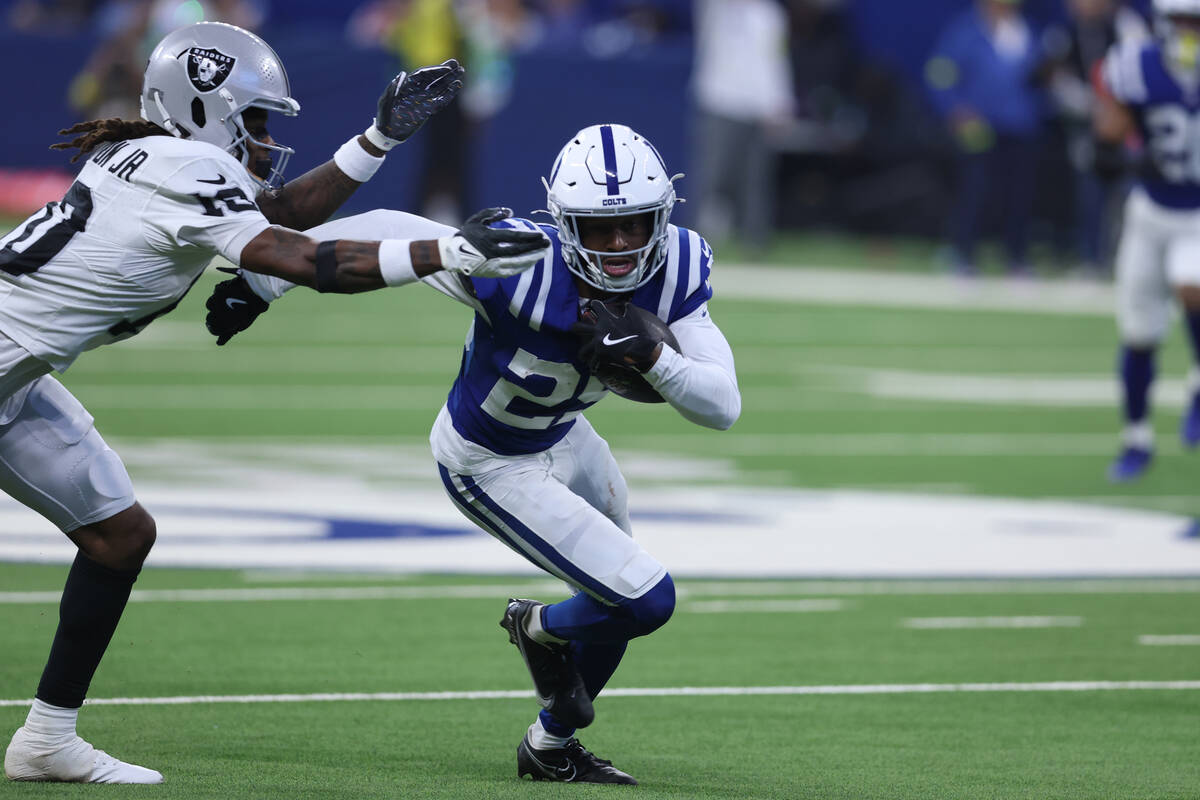 Indianapolis Colts cornerback Mekhi Blackmon (29) runs with the ball after an interception agai ...