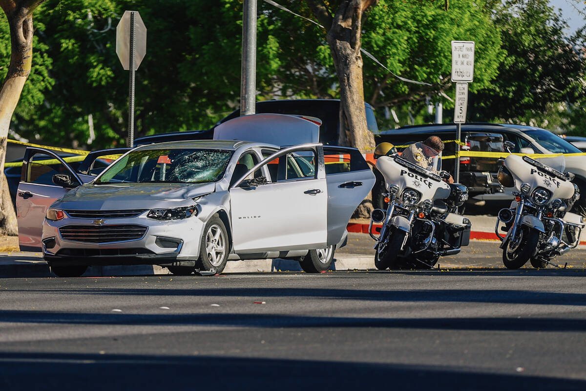 Metro police investigate a car after high school student McKenzie Scott, 18, was fatally struck ...