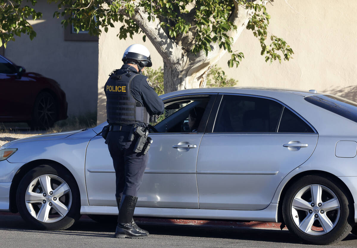A police officer from the Clark County School District Police Department's traffic unit is ...