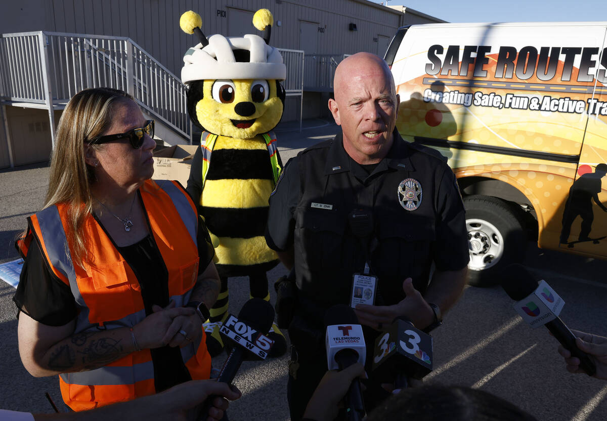 Lt. Bryan Zink, right, of the Clark County School District Police Department speaks about schoo ...