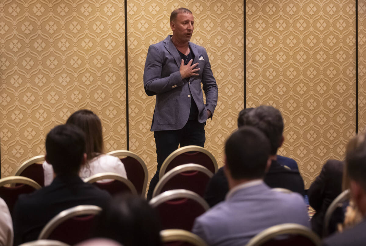 Event organizer Benjie Cherniak introduces Inor Roni Kagno, not pictured, who was photographing ...
