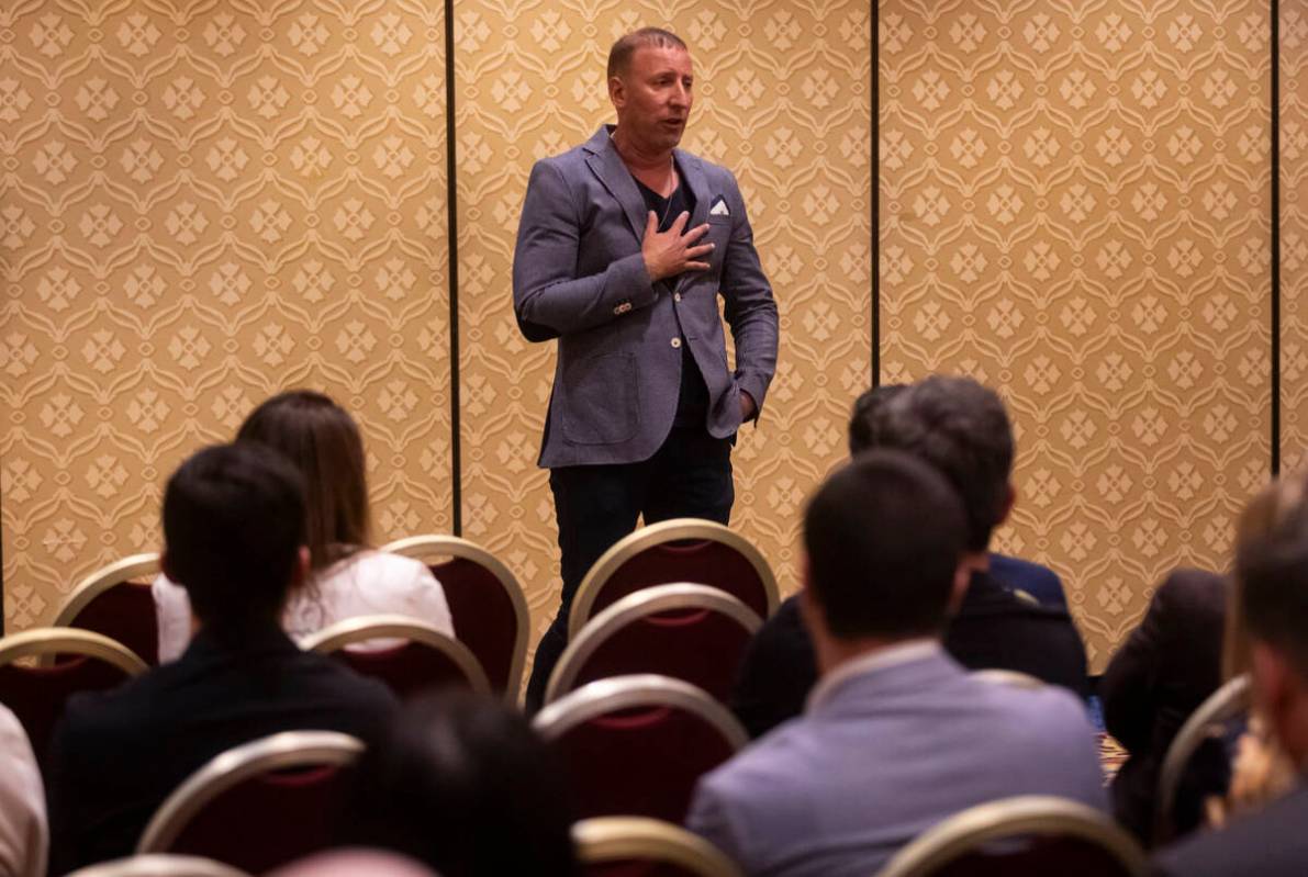 Event organizer Benjie Cherniak introduces Inor Roni Kagno, not pictured, who was photographing ...