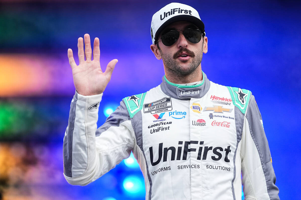 Chase Elliott waves to fans prior to a NASCAR Cup Series auto race at Charlotte Motor Speedway, ...