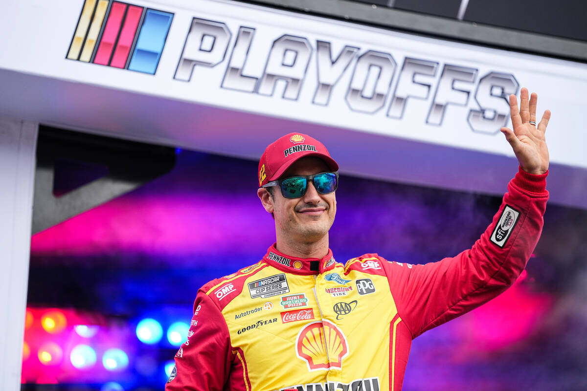 Joey Logano waves to fans prior to a NASCAR Cup Series auto race at Charlotte Motor Speedway, S ...