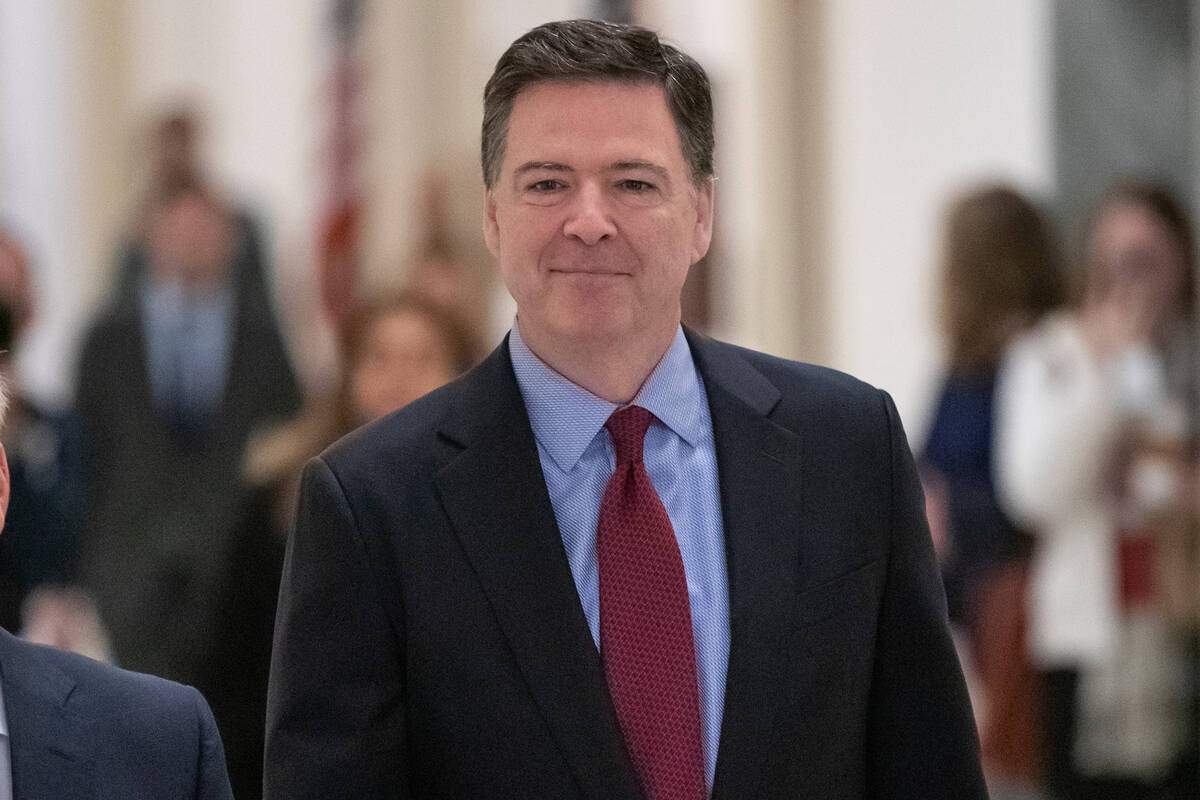 FILE - Former FBI Director James Comey, arrivex to testify under subpoena behind closed doors b ...