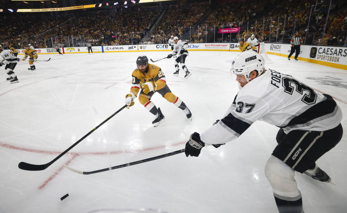 Golden Knights left wing Brandon Saad (20) and Los Angeles Kings left wing Warren Foegele (37) ...