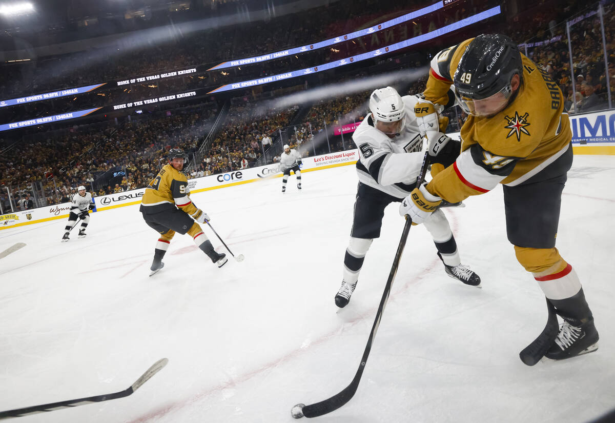 Golden Knights left wing Ivan Barbashev (49) passes the puck under pressure from Los Angeles Ki ...