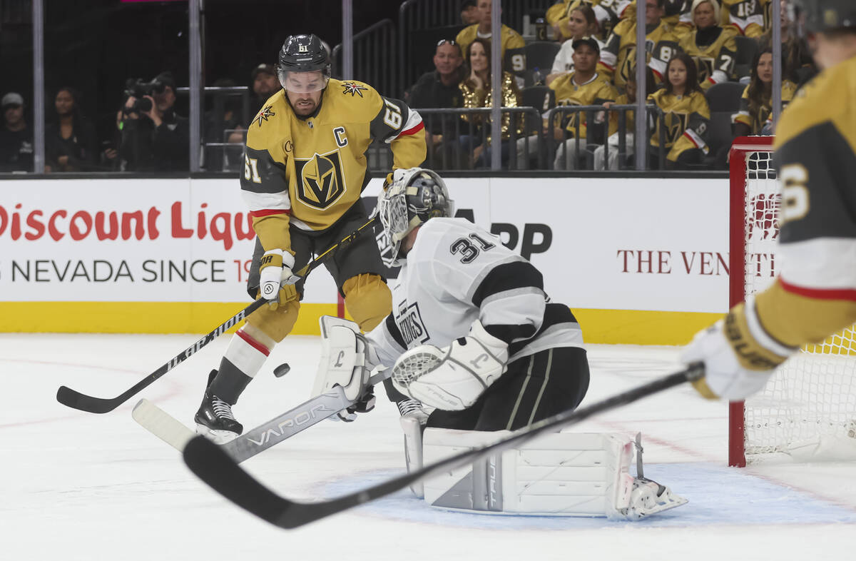 Los Angeles Kings goaltender Anton Forsberg (31) blocks a shot in front of Golden Knights right ...