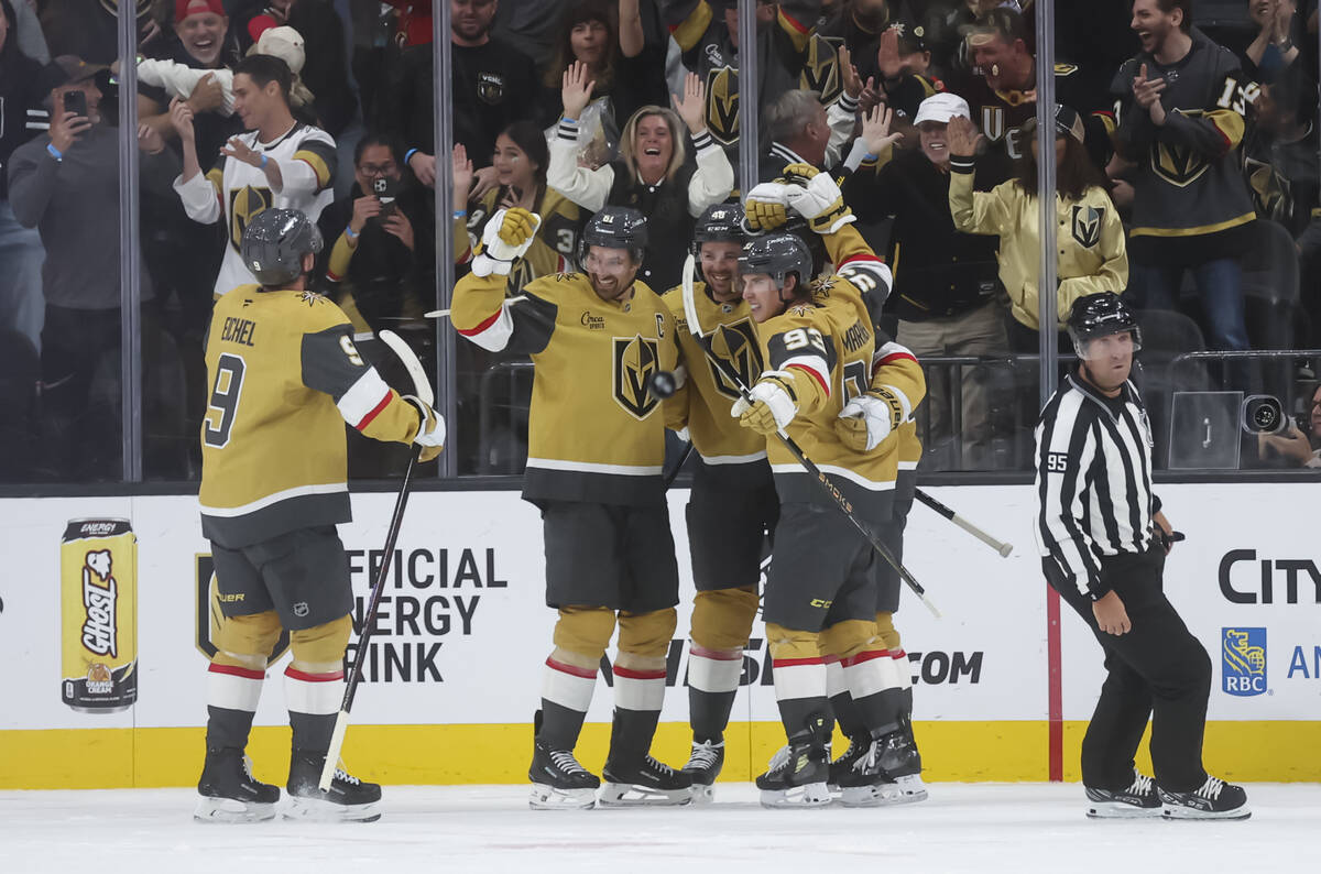 The Golden Knights celebrate a hat trick goal by Golden Knights right wing Pavel Dorofeyev, out ...
