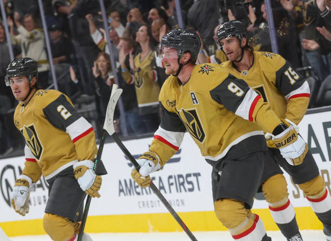 Golden Knights center Jack Eichel (9) celebrates after assisting on a goal by Golden Knights le ...