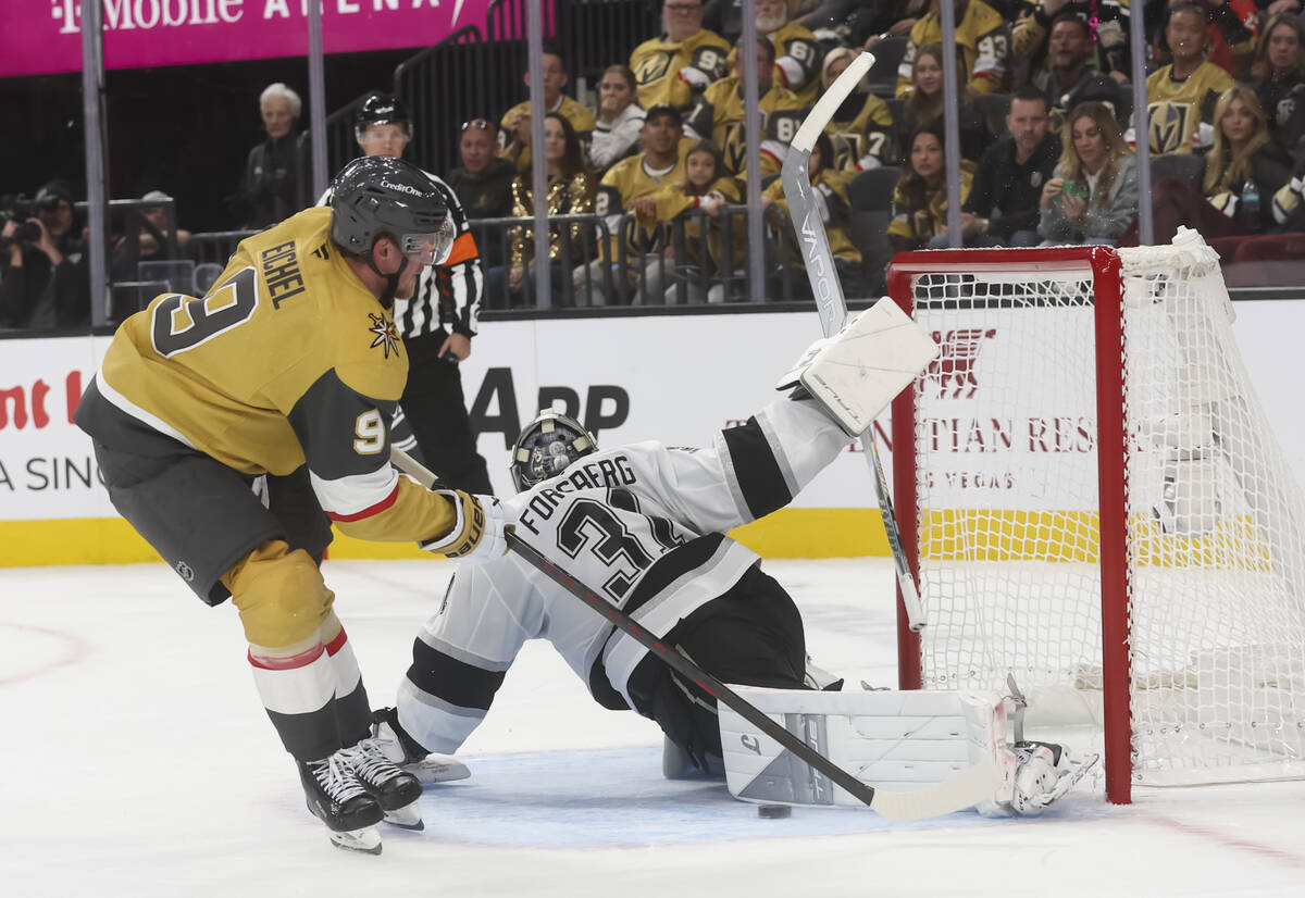 Los Angeles Kings goaltender Anton Forsberg (31) blocks the shot of Golden Knights center Jack ...