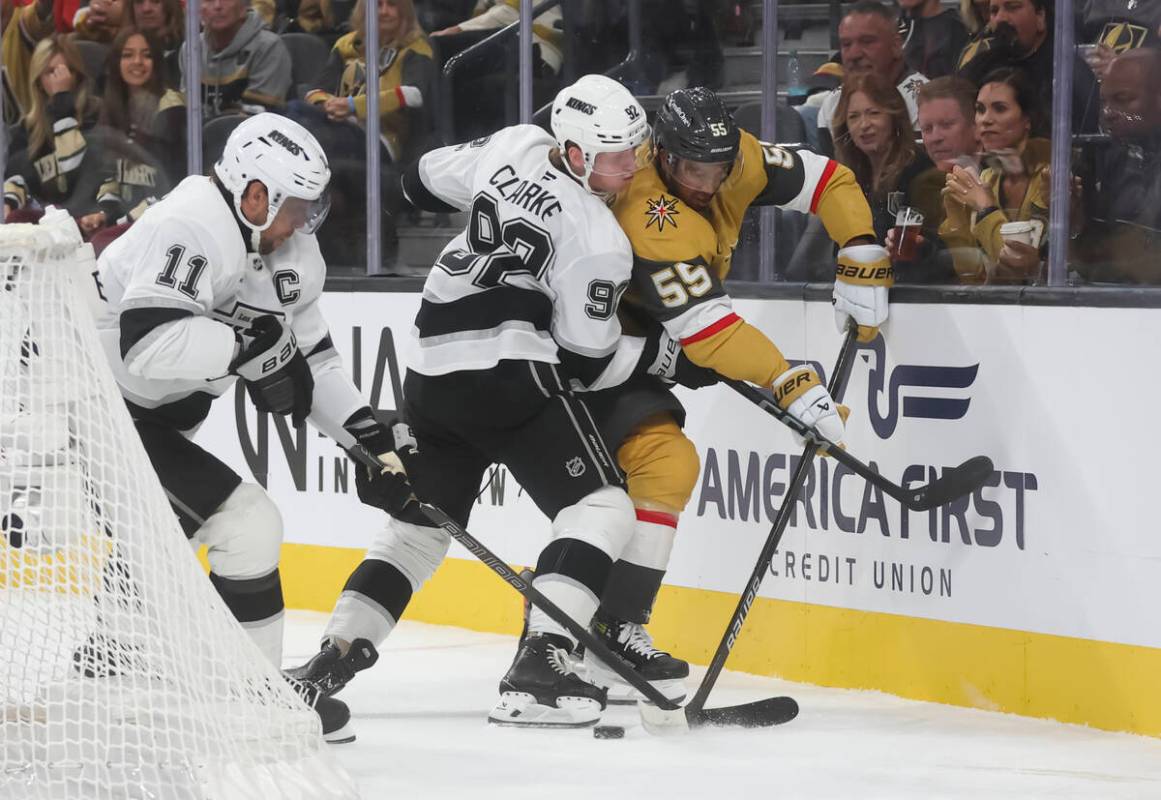 Golden Knights right wing Keegan Kolesar (55) passes the puck under pressure from Los Angeles K ...