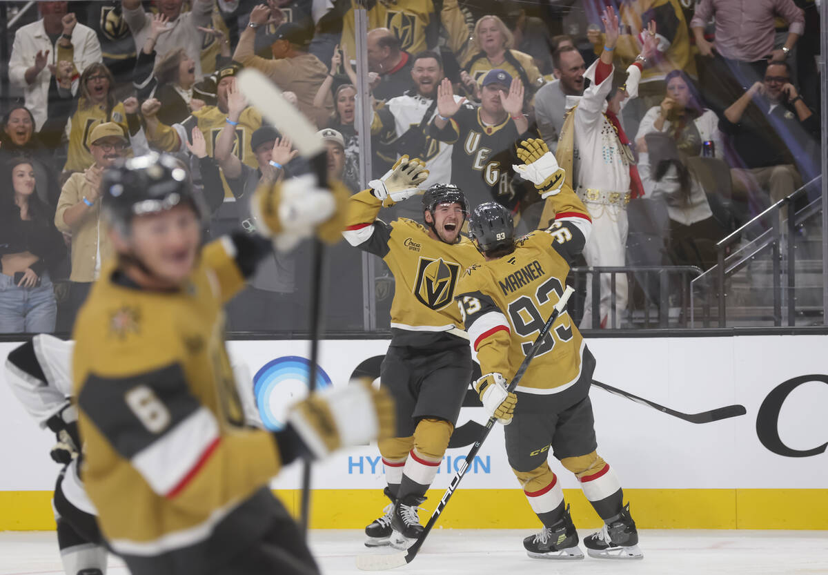 Golden Knights left wing Ivan Barbashev (49) and right wing Mitch Marner (93) celebrate a goal ...