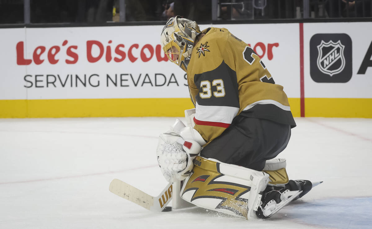 Golden Knights goaltender Adin Hill (33) blocks a shot from the Los Angeles Kings during overti ...