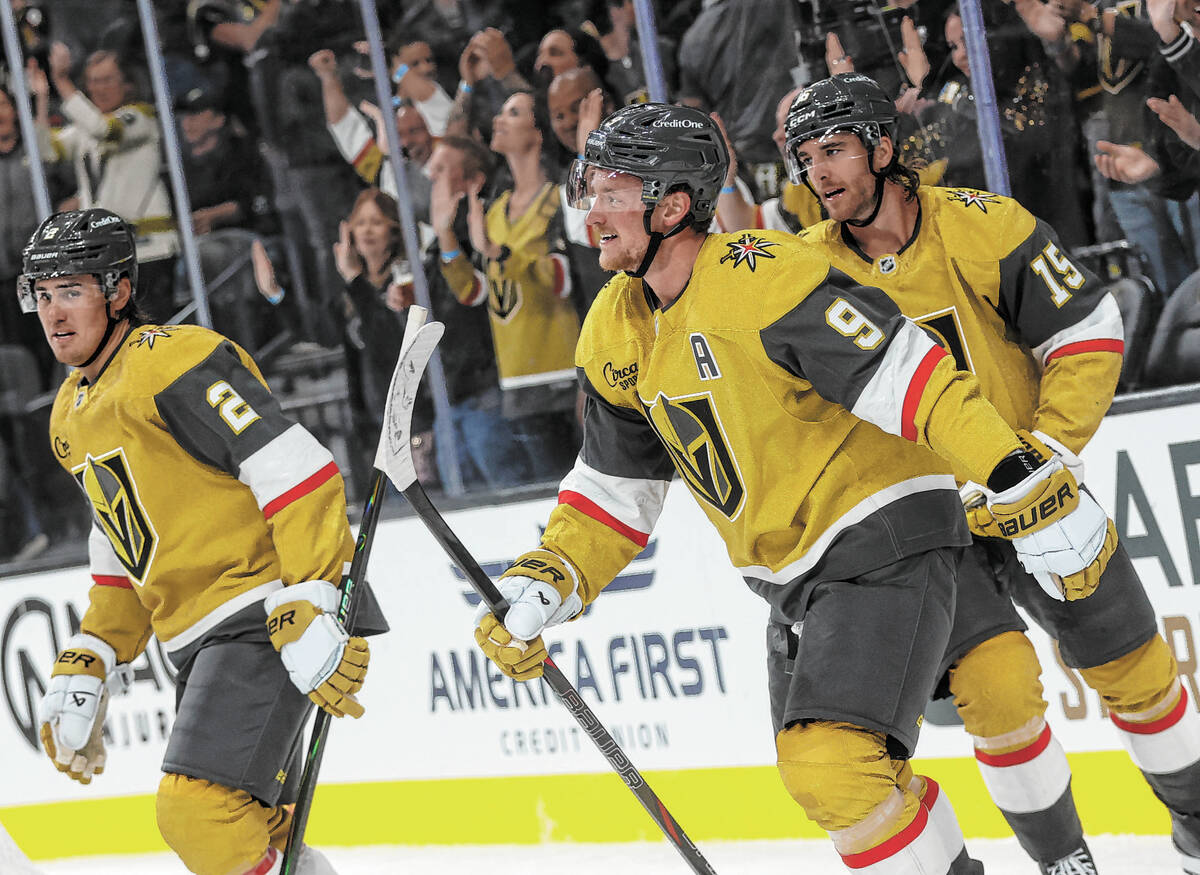 Golden Knights center Jack Eichel (9) celebrates after assisting on a goal by Golden Knights le ...