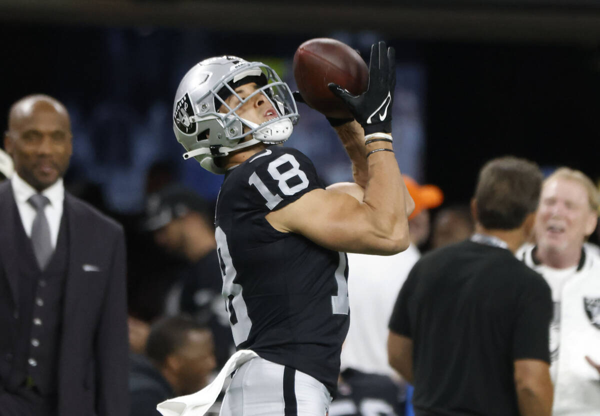 Raiders wide receiver Jack Bech (18) catches a pass during a warm up prior to an NFL football g ...